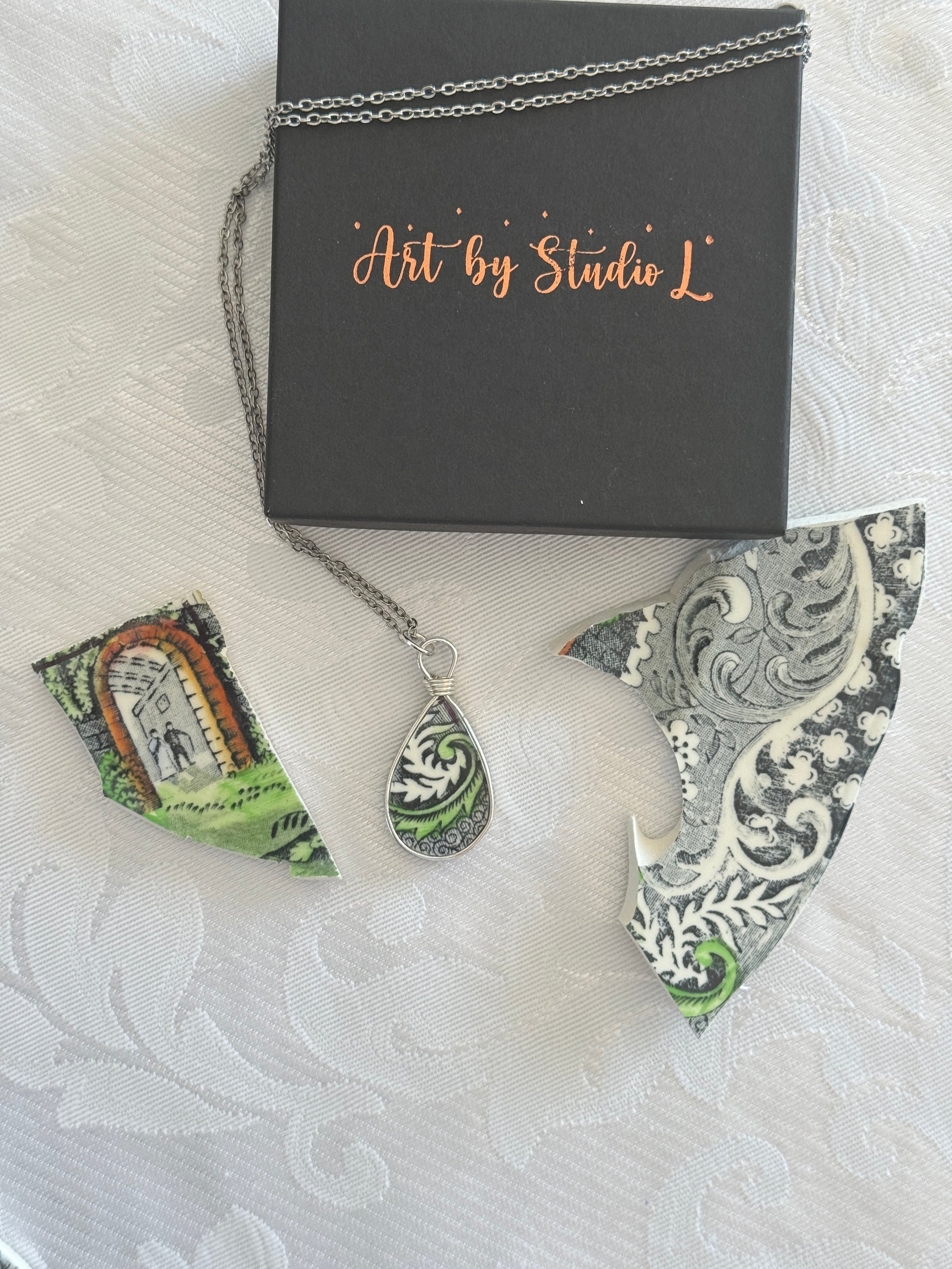 Decorative earrings with intricate patterns on a textured surface