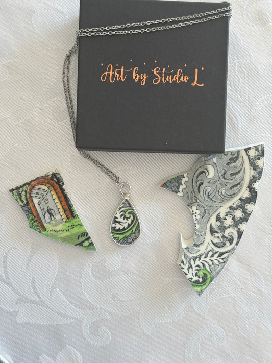 Decorative earrings with intricate patterns on a textured surface
