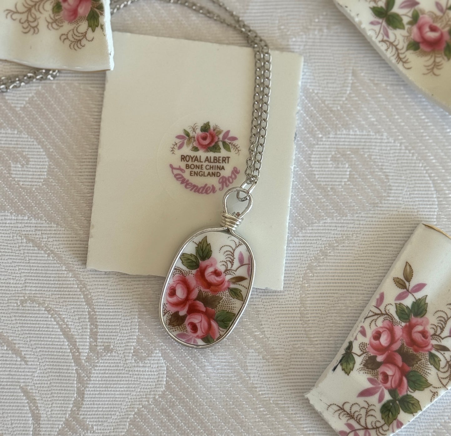 Necklace with floral pendant on a Royal Albert card with floral design