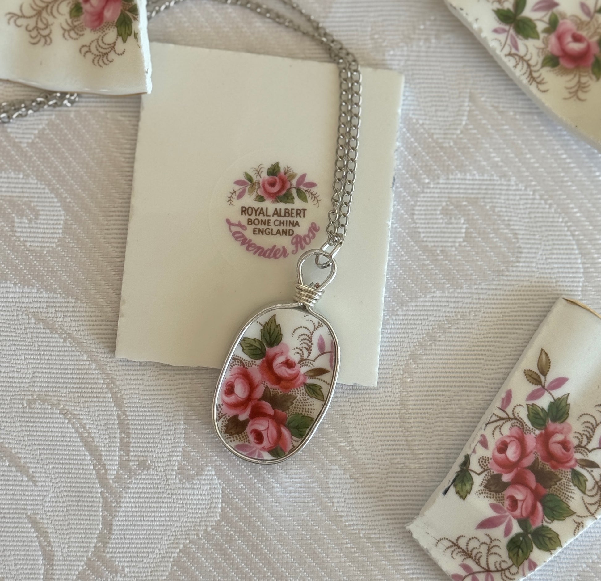 Necklace with floral pendant on a Royal Albert card with floral design