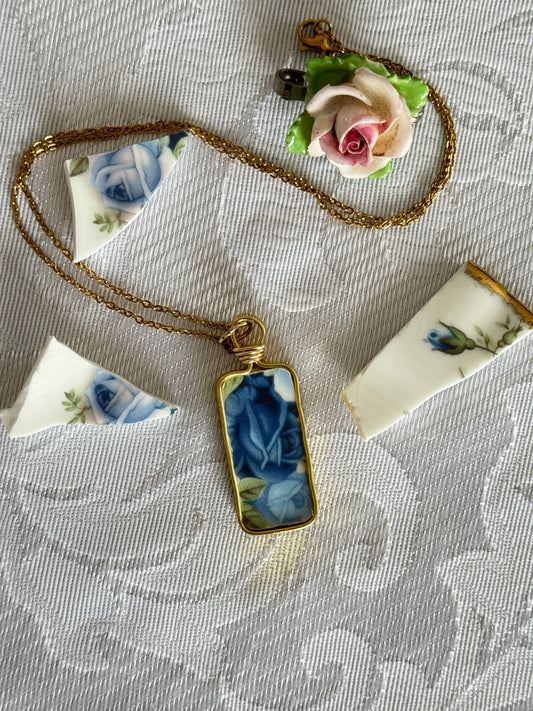 Necklace with a decorative pendant on a textured fabric background