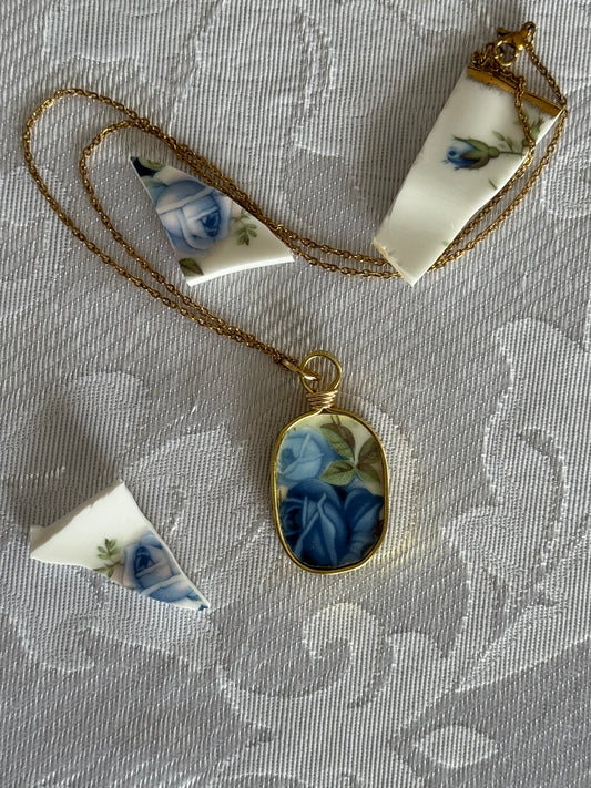 oval pendant with blue roses