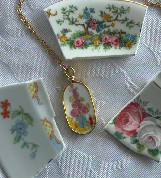 Decorative ceramic pieces with floral designs on a textured surface