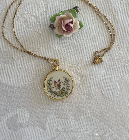 Decorative pendant with floral design on a textured fabric background