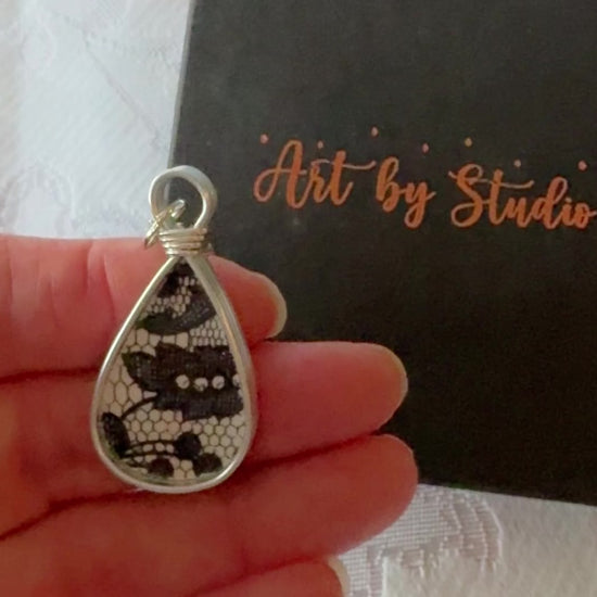 Blans and White design in a tear drop shaped pendant.